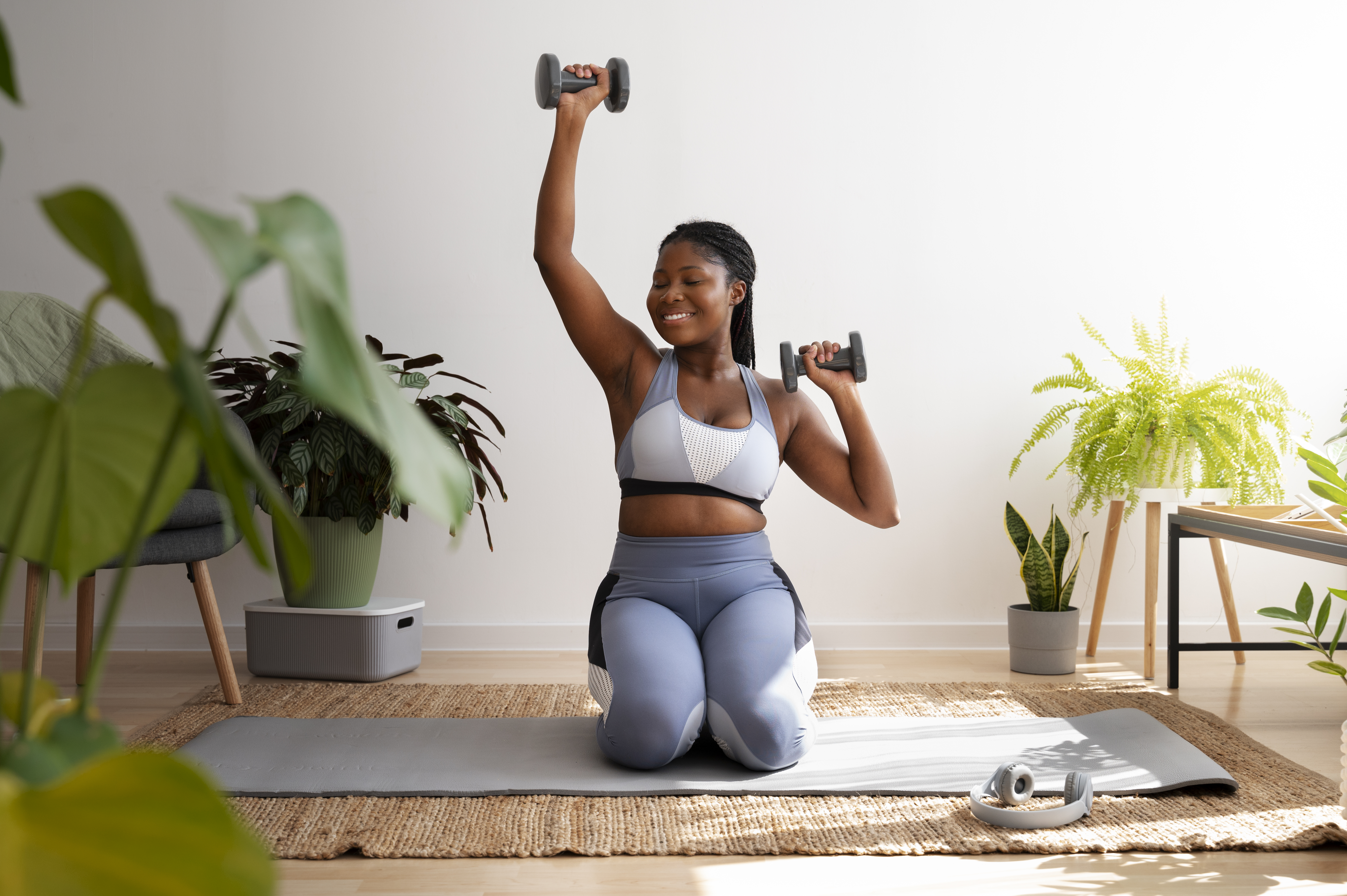 full-shot-woman-training-with-dumbbells.jpg