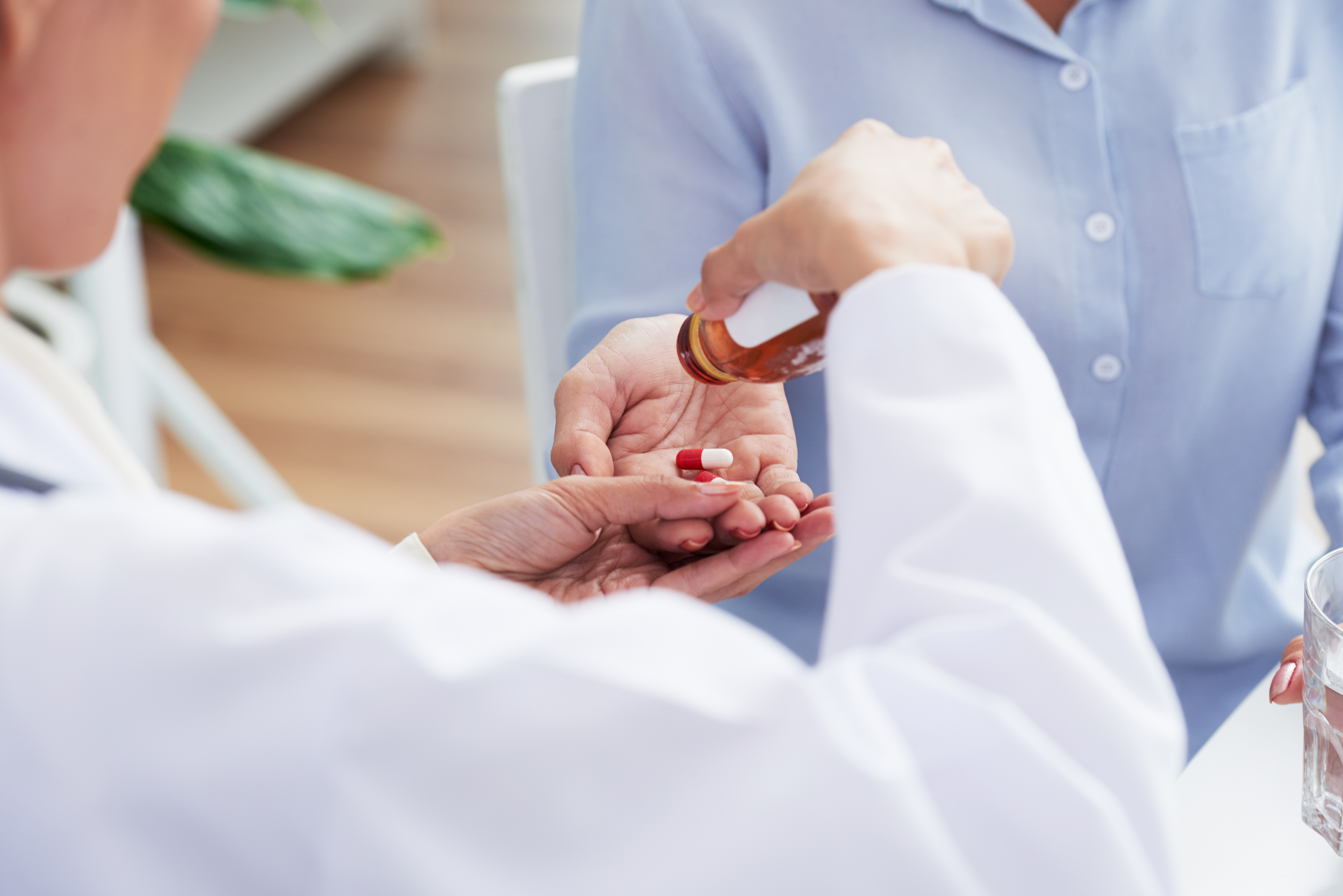 hands-unrecognizable-female-doctor-giving-pills-patient.jpg